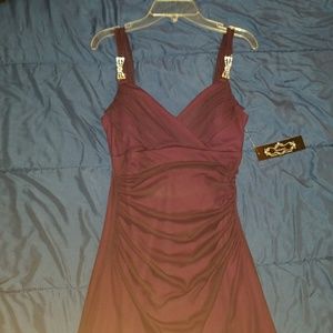 Red dress with jewels on the strap. Looks nice.